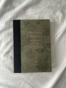 A book with a black cover and green writing on it